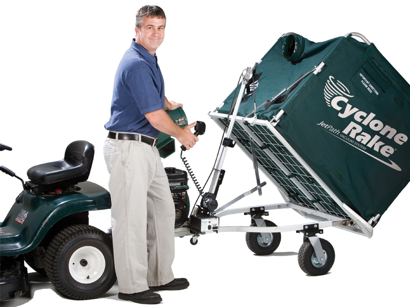 man using the power-lift unloader using the hand controller.