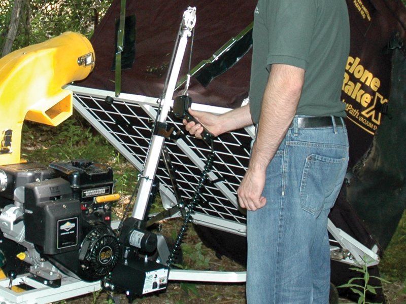 the power lift-unloader lifting the collector unit.