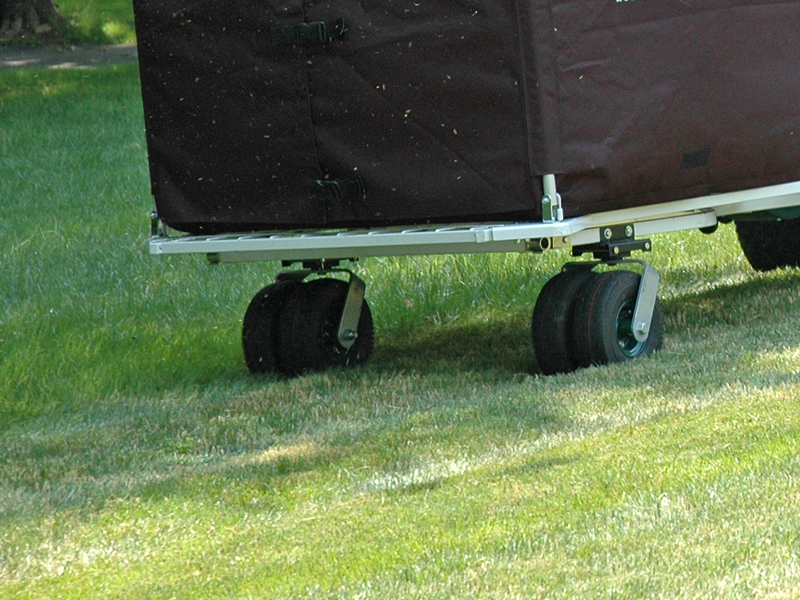 Dual-Pro Wheels attached to a Cyclone Rake on the grass.