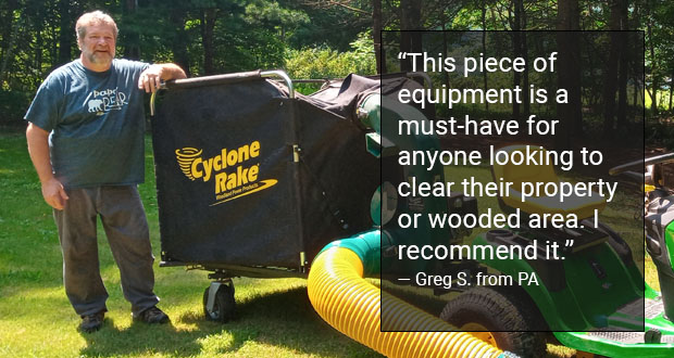 man proudly standing behind his Cyclone Rake leaf machine.